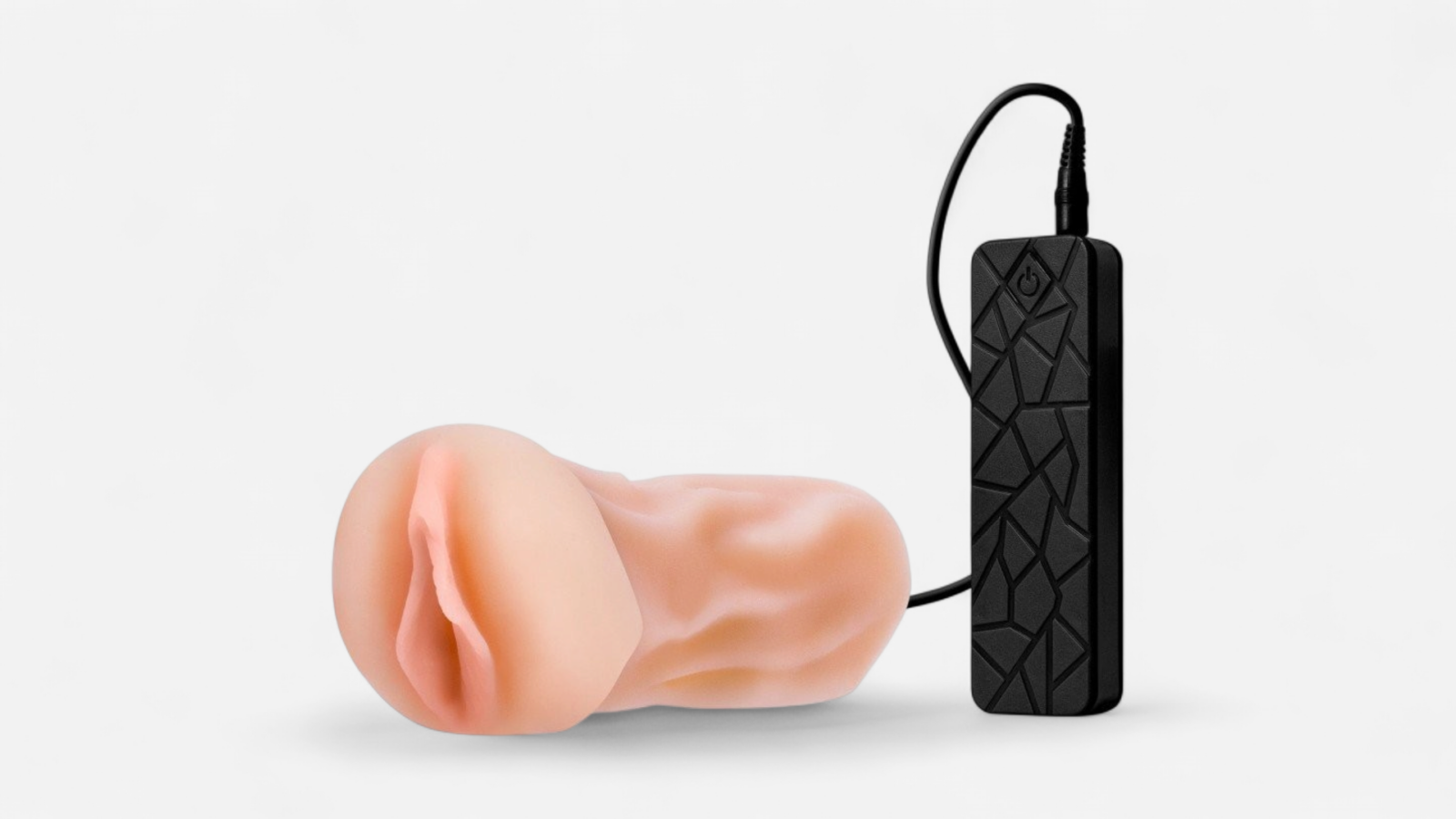 HU: Easy Job Jenny vibrációs férfi maszturbátor testszínű hüvellyel és fekete vezetékes vezérlővel. EN: Easy Job Jenny vibrating male masturbator with a flesh-toned sleeve and black wired controller.