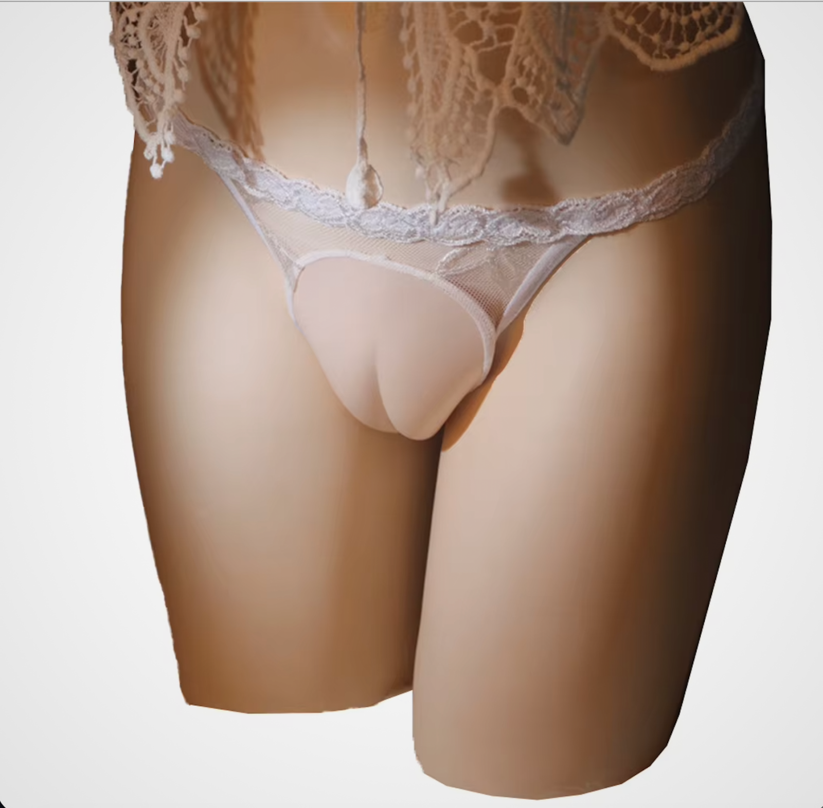 HU: Camel Cover fehér tevepata gaff tanga csipkés T-back fazonnal, elöl formázott kialakítással és diszkrét optikai simító hatással. EN: Camel Cover white camel toe gaff thong with lace T-back design, shaped front panel, and discreet visual smoothing effect.