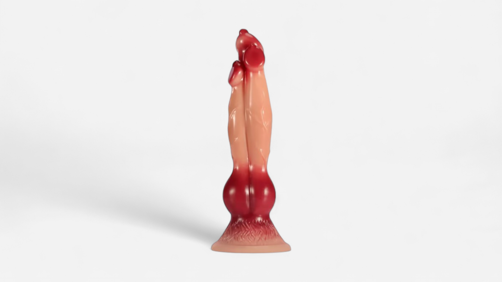 HU: Cerberus Knot háromfejű anál játék farkas-fantázia formával, piros és testszínű kivitelben, tapadókorongos talppal. EN: Cerberus Knot three-headed anal toy with wolf-fantasy shape, red and skin-tone design, and suction cup base.