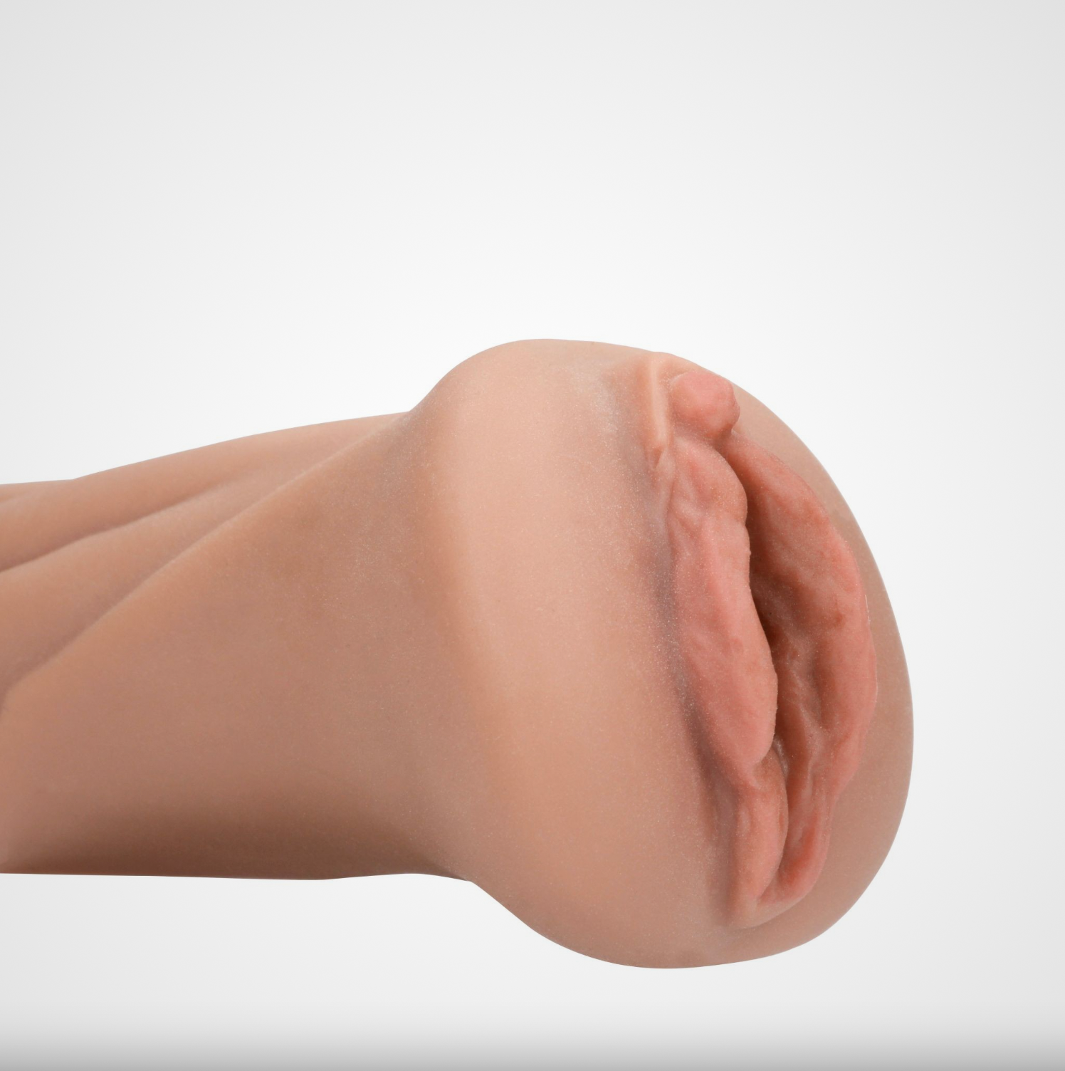 HU: Ăgyeletes Punci TPR maszturbĂĄtor realisztikus hĂŒvelynyĂlĂĄsĂĄnak rĂ©szletes közeli kĂ©pe EN: Detailed close-up of the realistic vaginal opening on the TPR masturbator